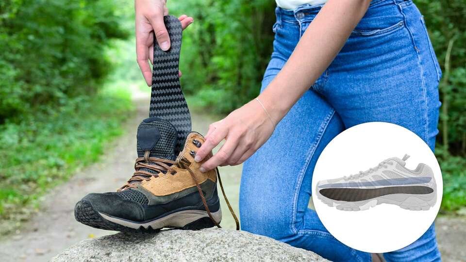 Cropped image showing a person placing the Carbon Footplate carbon fiber insole from Camp Scandinavia into a boot. An inset illustration shows that the carbon fiber insole should be positioned underneath the shoe's insole.